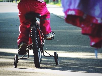 child riding tricycle